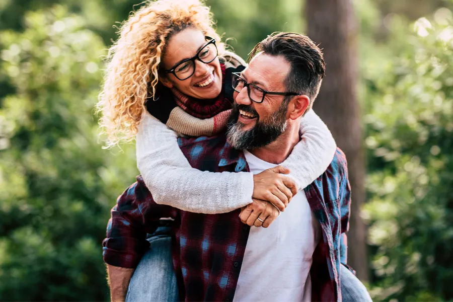 Metabolic-Syndrome-Clinic A couple enjoying a sunny fall day together. Receive expert metabolic syndrome care using bioidentical hormones by Optimal Wellness Medical Group in Grand Rapids.