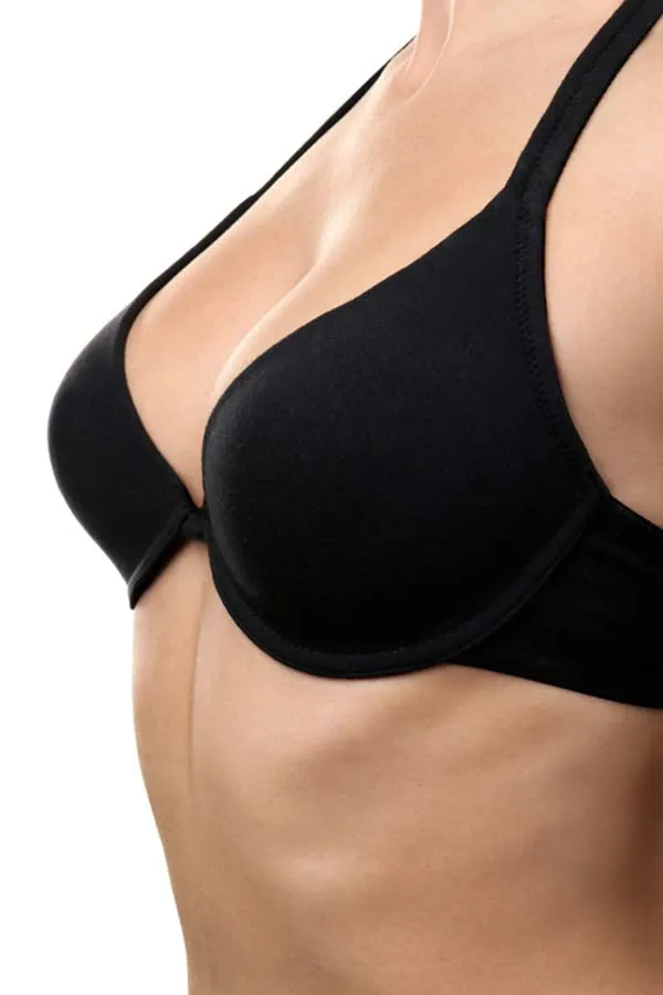 PRP-Breast-Lift-Treatment Close-up of a woman's chest wearing only a bra, showing the successful results of PRP breast lift treatment from Optimal Wellness Medical Group in Grand Rapids.