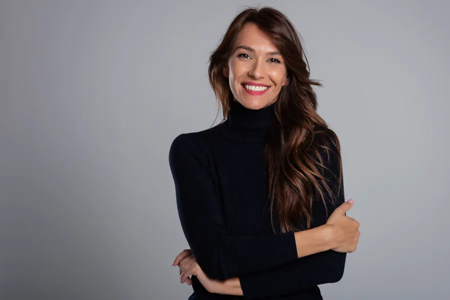 PRP-Scalp-Treatment-Doctor Woman smiling with healthy-looking hair representing PRP scalp treatment. Call Optimal Wellness Medical Group in Grand Rapids for your consultation.